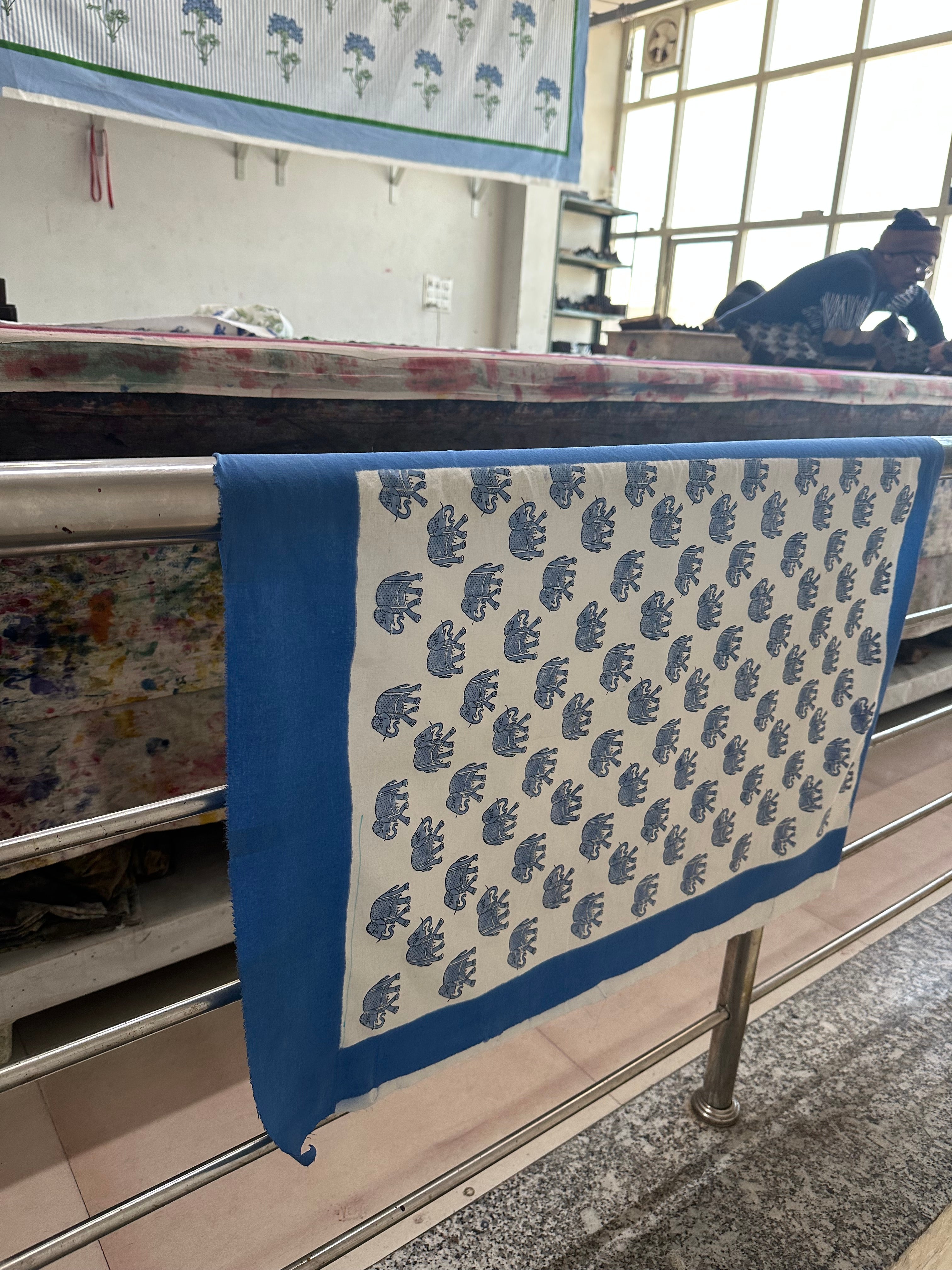 The blocks are pressed onto fabric to create beautiful designs